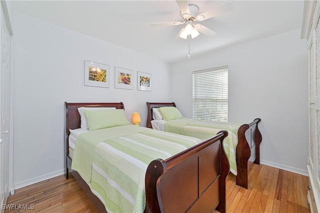 bedroom featuring ceiling fan and light wood-type flooring