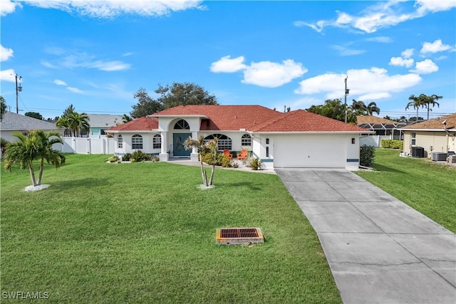 view of front facade with a garage, cooling unit, and a front lawn