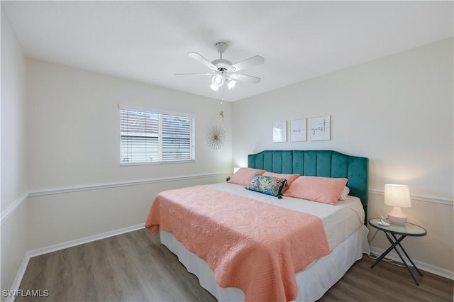 bedroom featuring hardwood / wood-style floors and ceiling fan