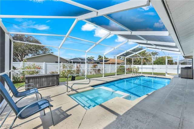 view of pool with a lanai and a patio