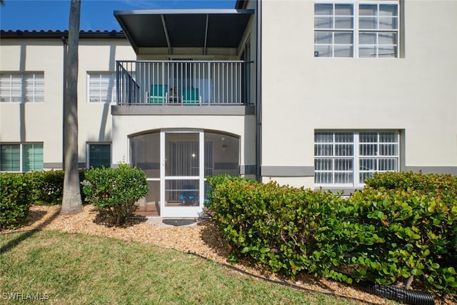 back of house with a balcony