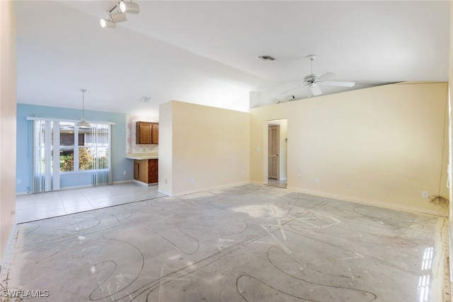 unfurnished room with lofted ceiling and ceiling fan