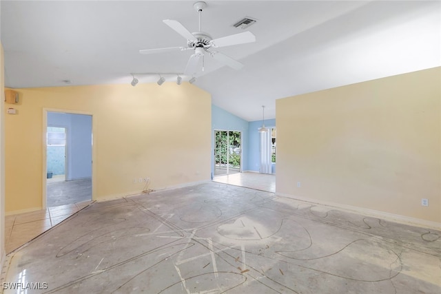 unfurnished room featuring lofted ceiling, track lighting, and ceiling fan