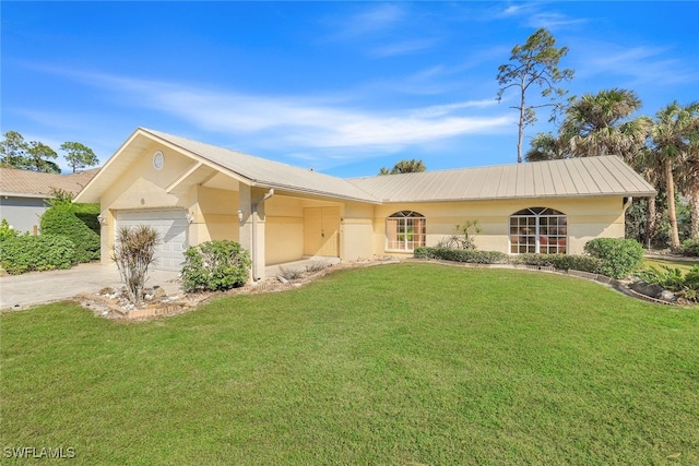 ranch-style home with a garage and a front yard