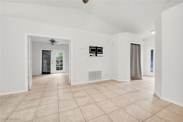 tiled spare room with ceiling fan and lofted ceiling