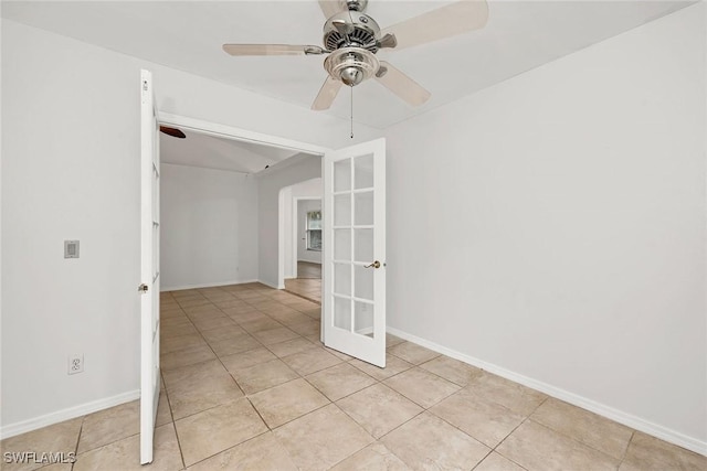 tiled spare room with french doors and ceiling fan