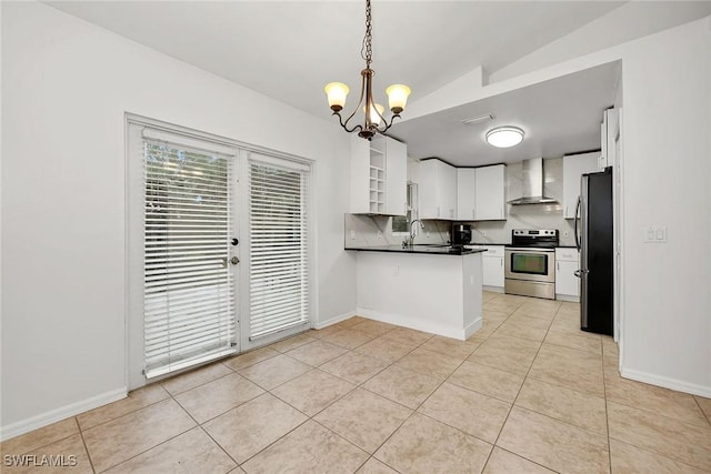 kitchen featuring sink, white cabinetry, pendant lighting, stainless steel appliances, and wall chimney range hood