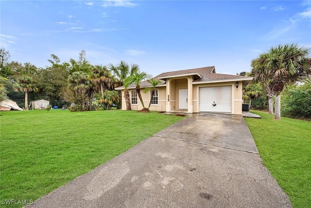 view of front of property featuring a garage and a front lawn