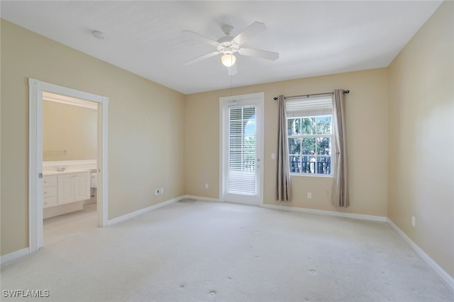 carpeted empty room with ceiling fan