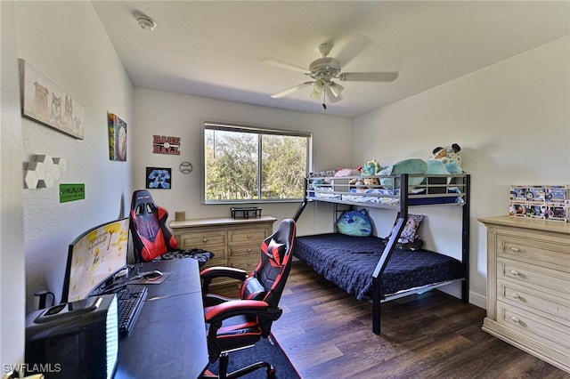 bedroom featuring dark hardwood / wood-style floors and ceiling fan