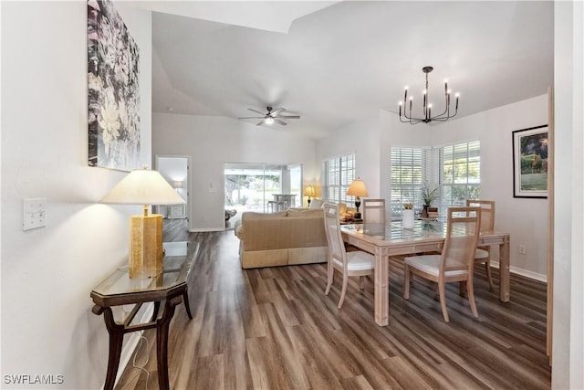 dining space featuring hardwood / wood-style flooring, ceiling fan with notable chandelier, and a wealth of natural light