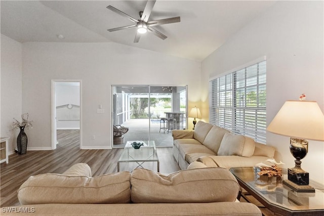 living room featuring wood-type flooring, vaulted ceiling, and ceiling fan