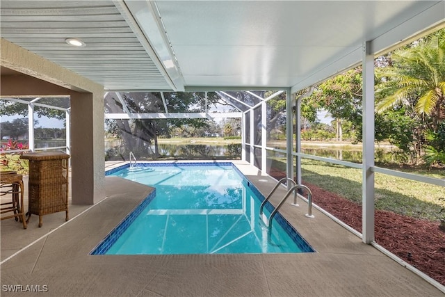 view of pool with a lanai and a patio