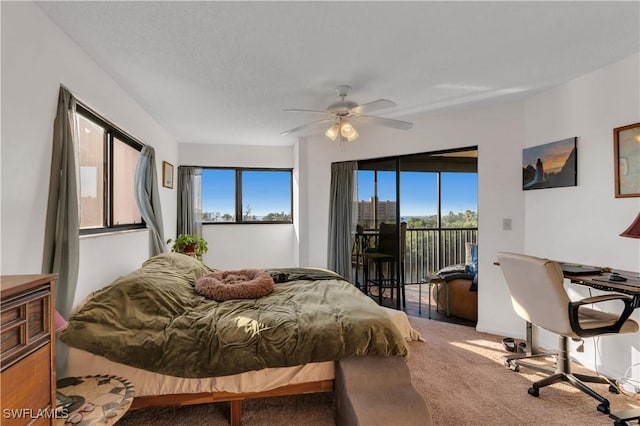 carpeted bedroom with access to outside and ceiling fan