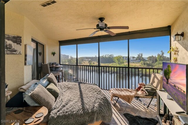 sunroom / solarium with ceiling fan