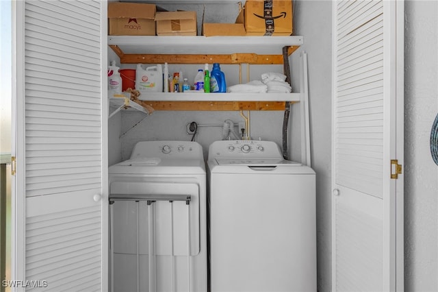 laundry room featuring washing machine and clothes dryer