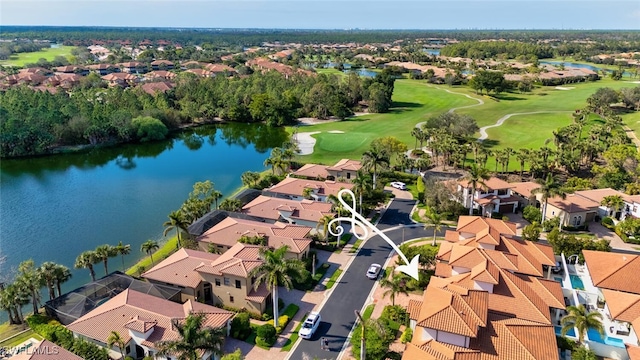 drone / aerial view featuring a residential view, a water view, and view of golf course