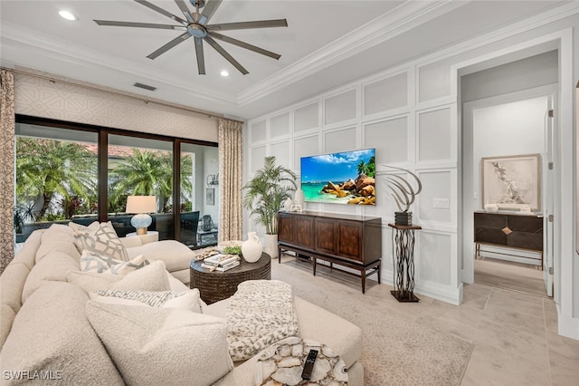 living room with visible vents, recessed lighting, crown molding, a decorative wall, and ceiling fan