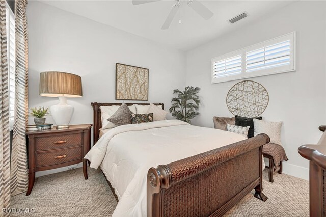 bedroom with light colored carpet and ceiling fan