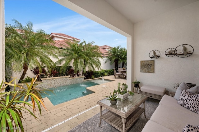 outdoor pool with an outdoor living space and a patio