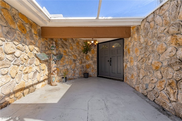 doorway to property featuring a patio