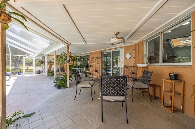 view of patio with glass enclosure