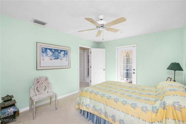 bedroom featuring ceiling fan and light colored carpet