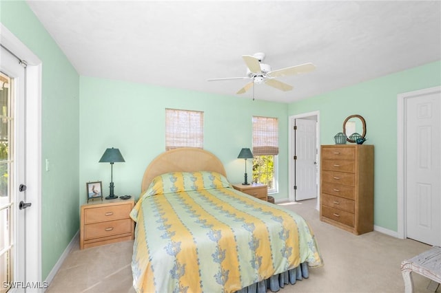 bedroom featuring light carpet and ceiling fan