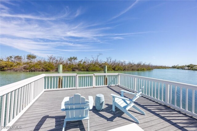 wooden deck featuring a water view