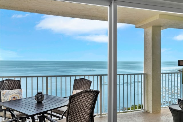 balcony featuring a water view