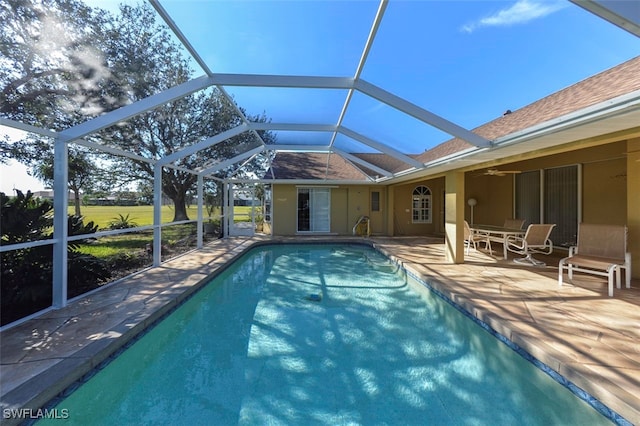 view of pool featuring a patio and glass enclosure