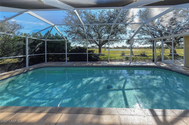 view of swimming pool with a lanai