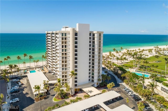 bird's eye view featuring a view of the beach and a water view