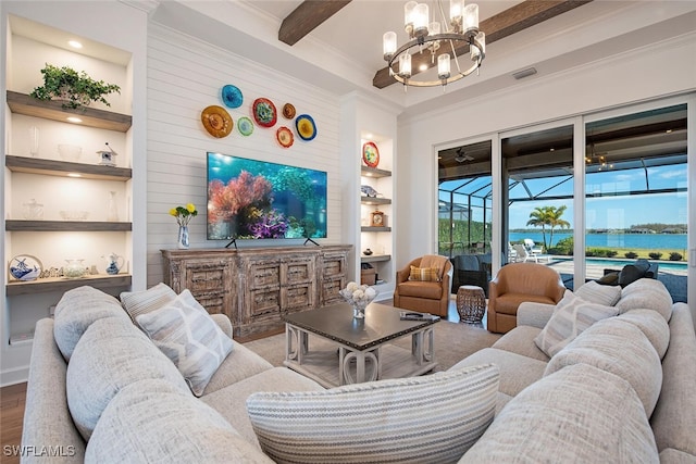 living room with wood-type flooring, ornamental molding, built in features, a notable chandelier, and beamed ceiling