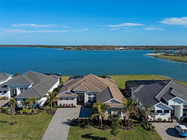 birds eye view of property featuring a water view