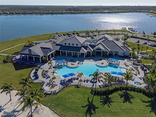 birds eye view of property with a water view