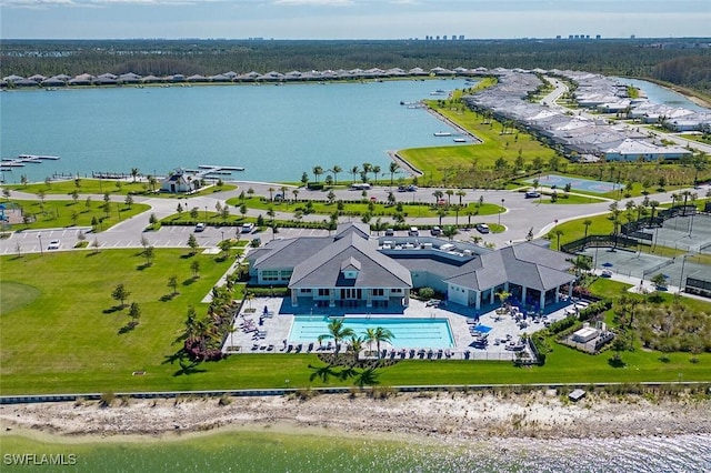 birds eye view of property with a water view