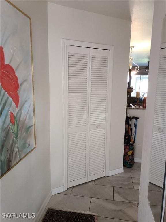 hallway featuring light tile patterned floors