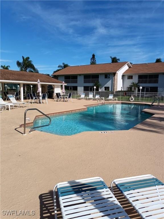 view of swimming pool featuring a patio area