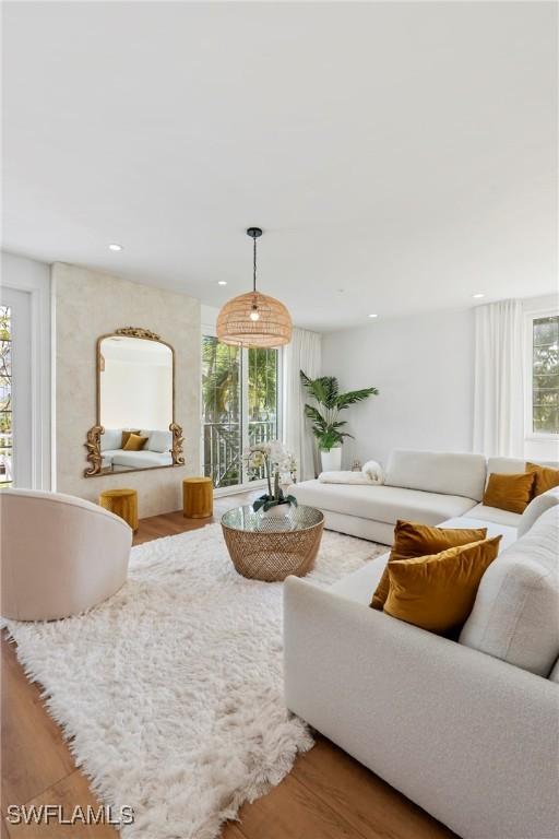 living room featuring a healthy amount of sunlight and hardwood / wood-style floors