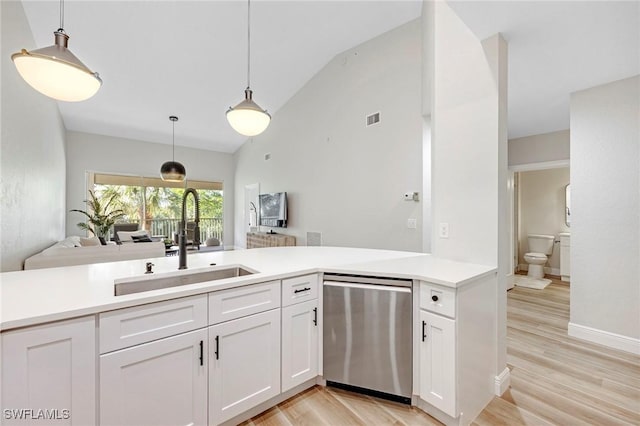 kitchen featuring light countertops, visible vents, white cabinetry, a sink, and dishwasher