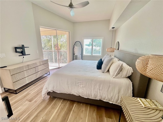 bedroom with access to outside, ceiling fan, and wood finished floors