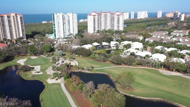 bird's eye view with view of golf course, a water view, and a city view