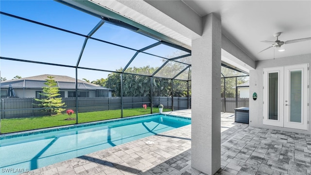 view of swimming pool with a patio, a fenced backyard, a lanai, a ceiling fan, and a fenced in pool