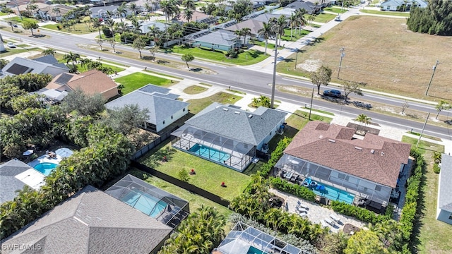 birds eye view of property with a residential view