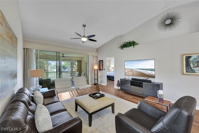 living room with vaulted ceiling, ceiling fan, and light hardwood / wood-style floors