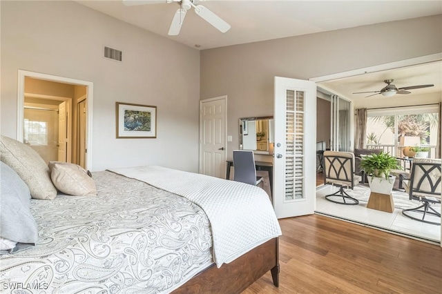 bedroom featuring hardwood / wood-style floors, access to outside, and ceiling fan