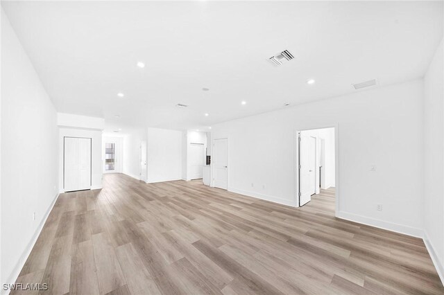 spare room with light hardwood / wood-style flooring