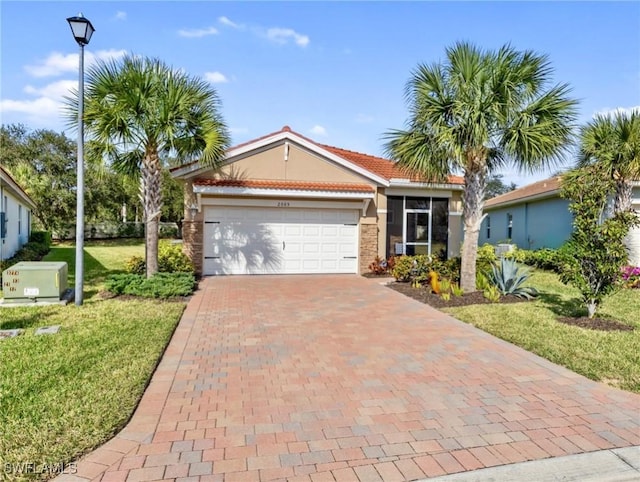 view of front facade with a garage and a front yard