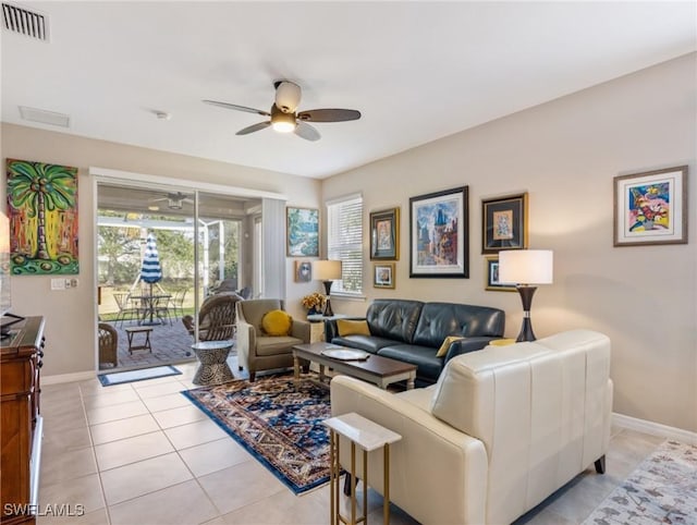 living room with light tile patterned flooring and ceiling fan